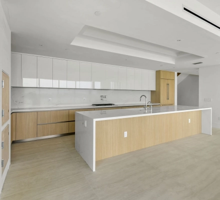 Open kitchen and living room with marina water view
