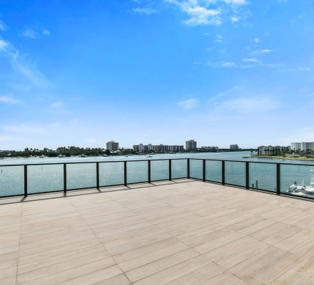 Wide rooftop terrace with panoramic water views