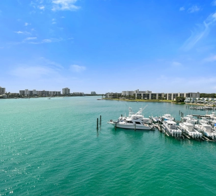 Marina with docked boats and surrounding buildings